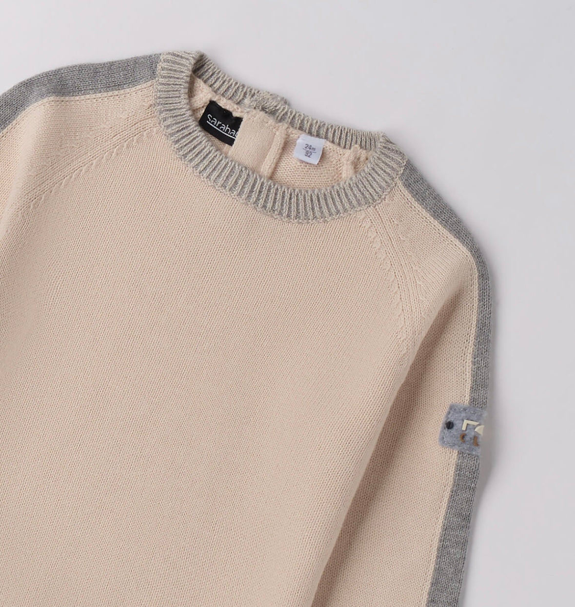 Tricot bambino invernale nel colore ecrù