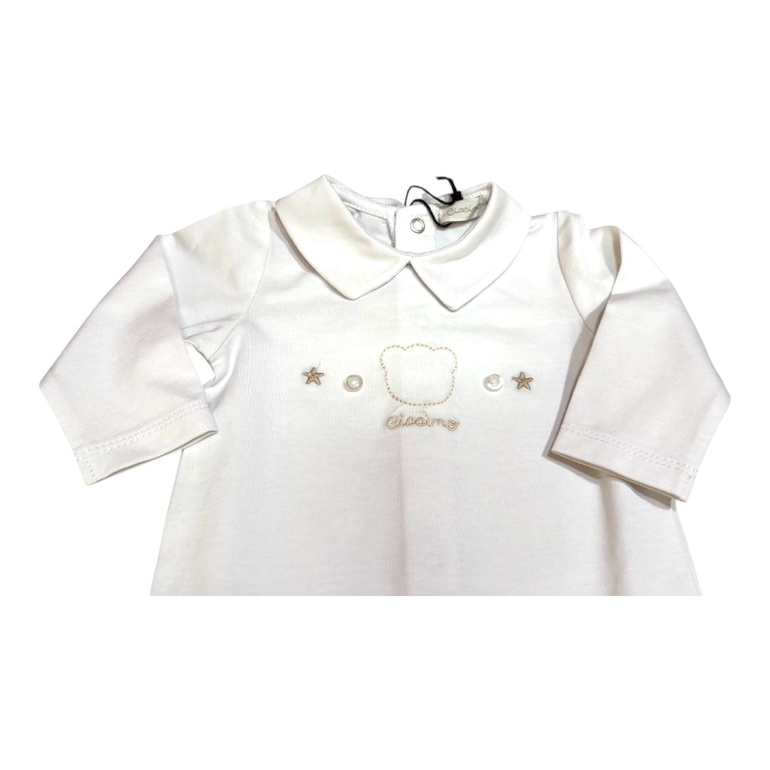 Tutina maniche lunghe con colletto.
