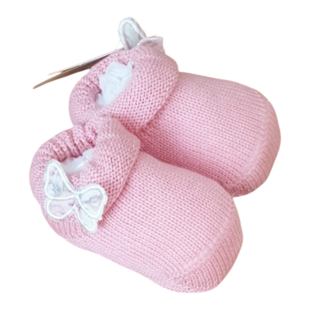 Salopette neonata rosa con polo bianca, e babbucce abbinate.