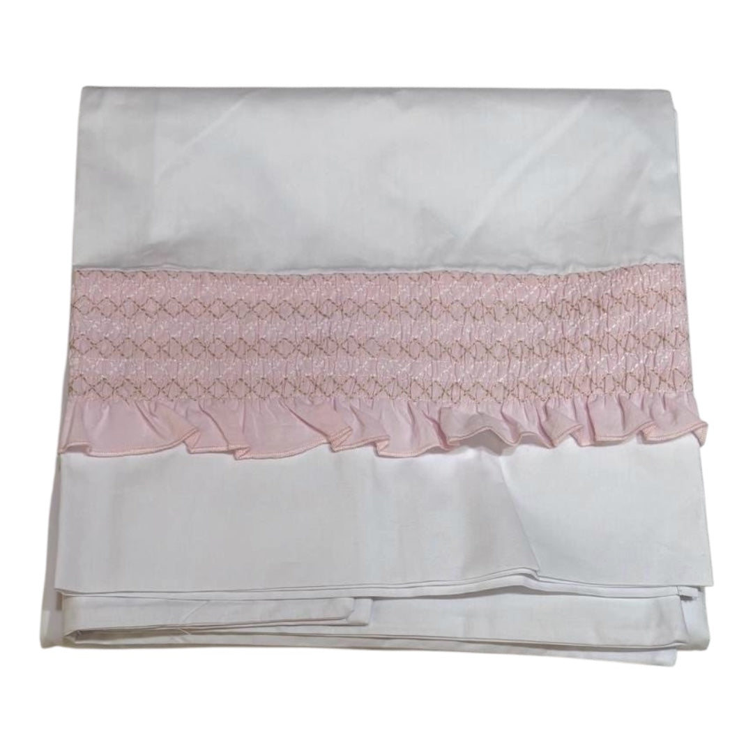 Lenzuola di colore bianco con fascia rosa, in cotone.