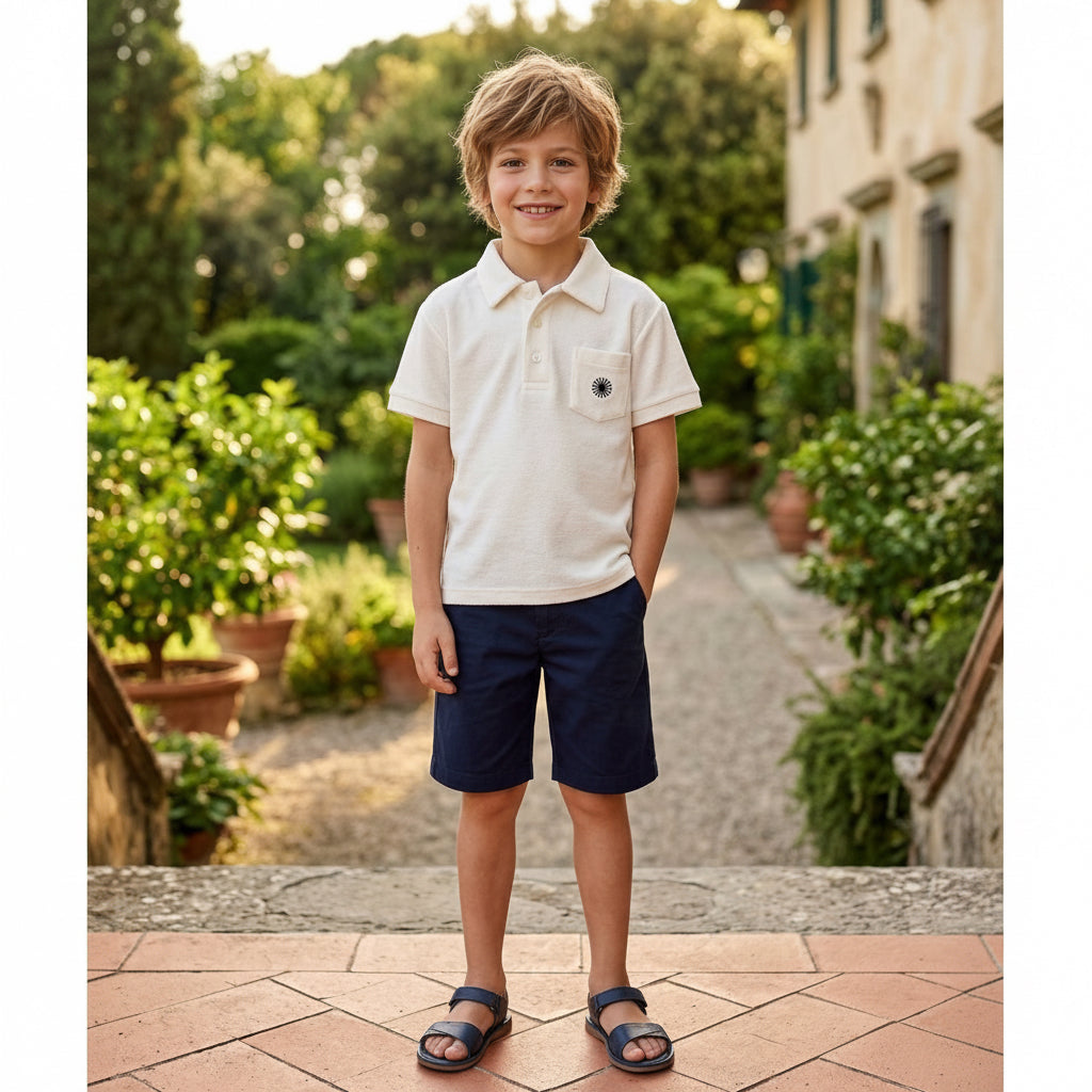 Completo bambino composto da polo bianca e bermuda blu
