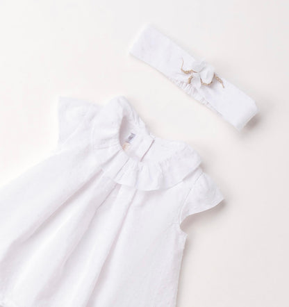Pagliaccetto neonata in cotone bianco con fascia per capelli