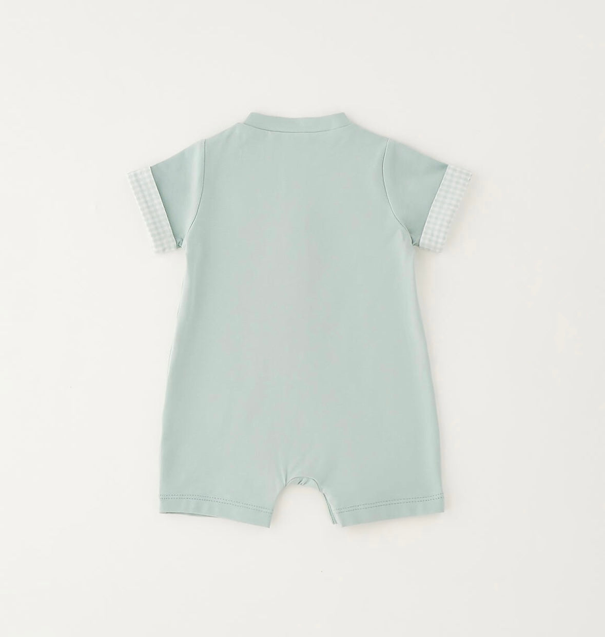 Pagliaccetto da neonato verde con applicazioni davanti