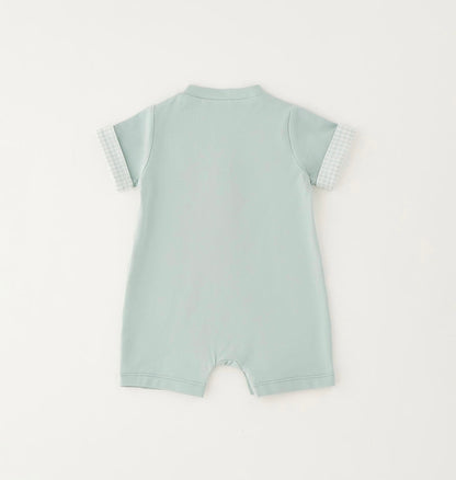 Pagliaccetto da neonato verde con applicazioni davanti