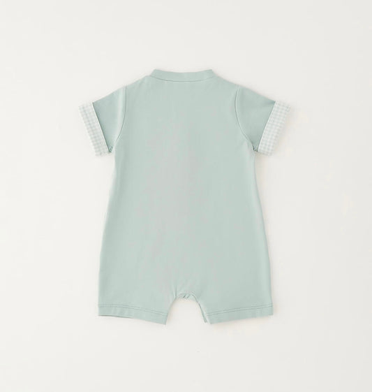 Pagliaccetto da neonato verde con applicazioni davanti