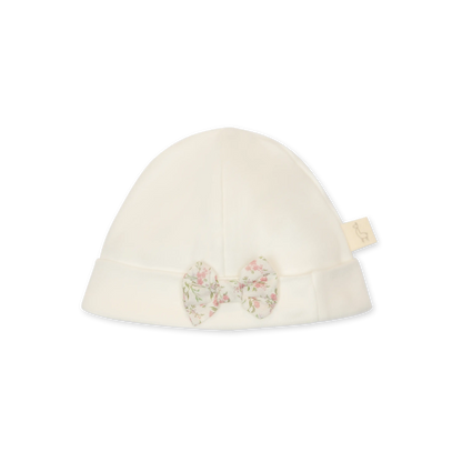 Cappellino in cotone bianco con fiocchetto a fantasia