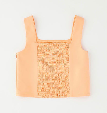 Top bambina nel colore arancione