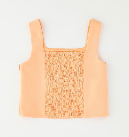Top bambina nel colore arancione