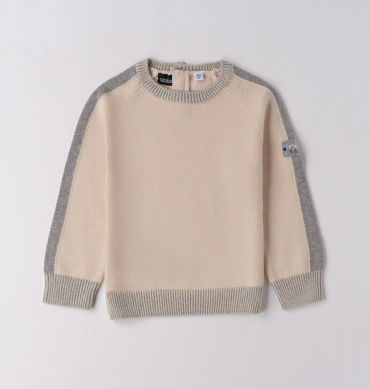 Tricot bambino invernale nel colore ecrù