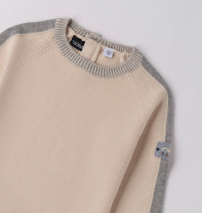 Tricot bambino invernale nel colore ecrù
