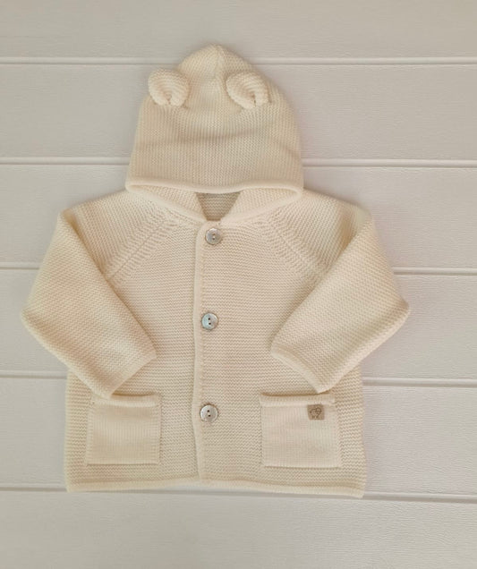 Cappottino con orecchie in pura lana Merino, nel colore panna.